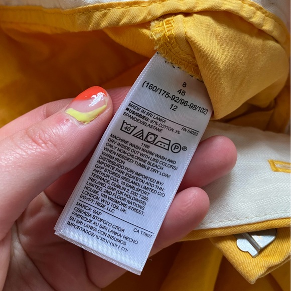 GAP High-Rise Pleated Khaki Shorts in Mustard Yellow - Picture 6 of 7